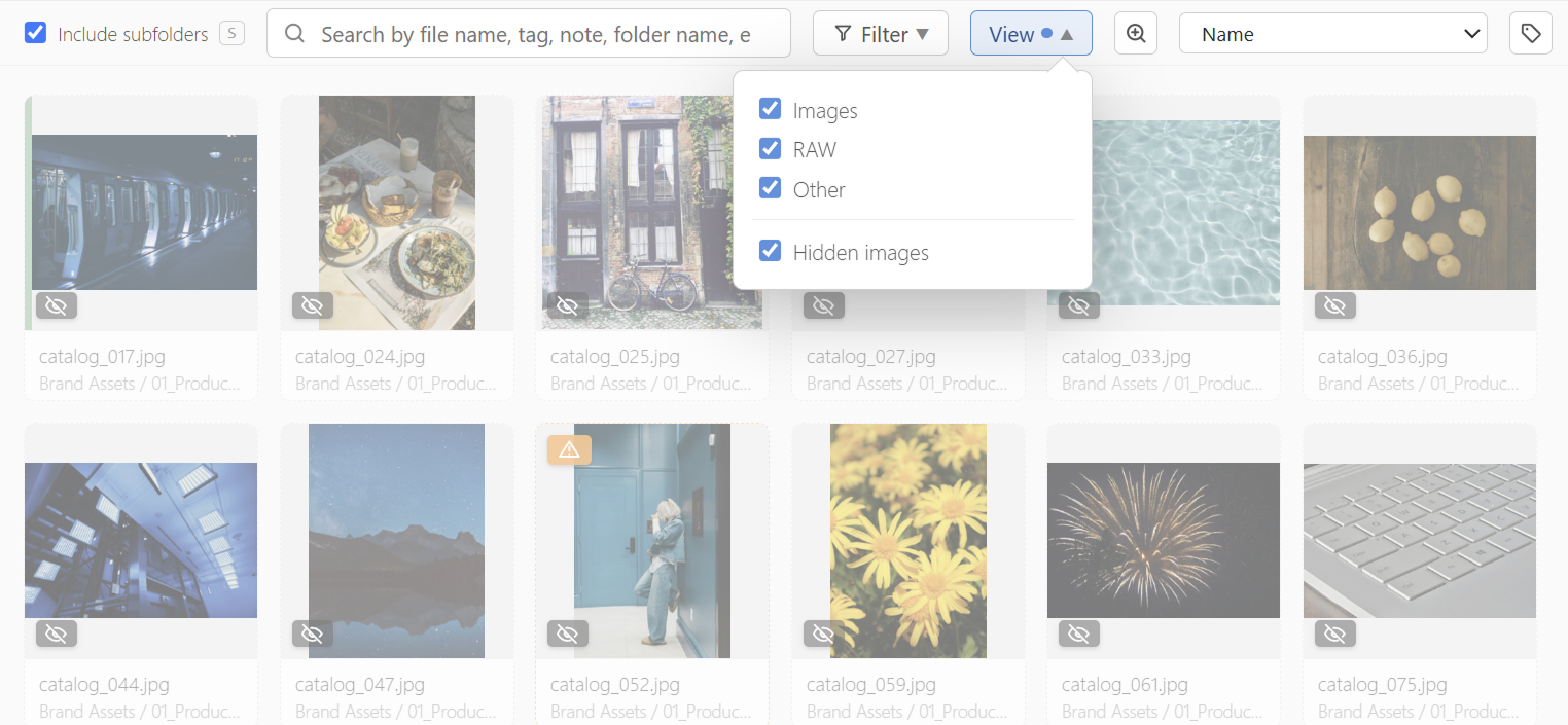 A list where hidden images appear dimmed, with a view menu toggling "hidden images"